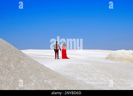 Couple looking from a hill  to the future. Pasabaglari Fairy chimneys park, Cappadocia, Turkey. Stock Photo