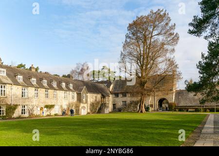 Historic medieval buildings in courtyard of Great Hall, Dartington Hall estate, south Devon, England, UK Stock Photo