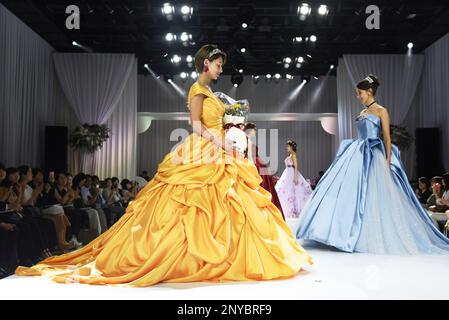 A models present wedding dresses inspired by Disney Princess