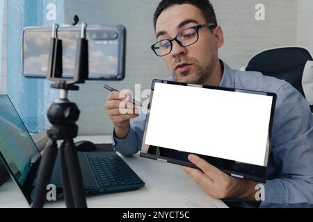 Man Participating In Online Coaching Session Using Laptop. A business coach conducts a training webinar. Lecturer on distance learning. copy space. bl Stock Photo