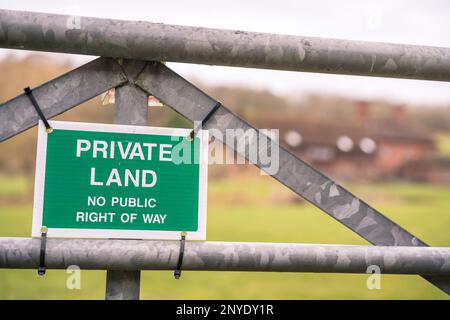 Private land sign, no public right of way, attached to a steel galvanized farm gate. Stock Photo