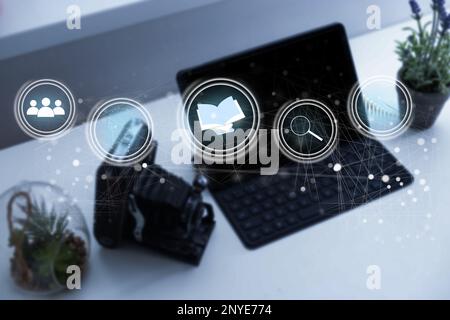 Document Management System (DMS) being setup by IT consultant working on laptop computer in office with document directory. Software for archiving Stock Photo