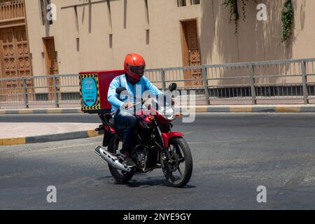 Delivery Rider Talabat Delivery boy Talabat food Delivery rider on Doha road Stock Photo - Alamy