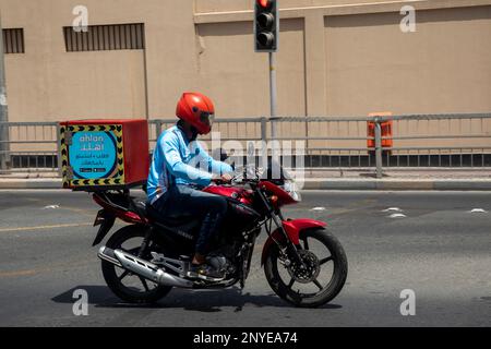 Delivery Rider Talabat Talabat delivery rider on a motorbike delivering food in Manama ...