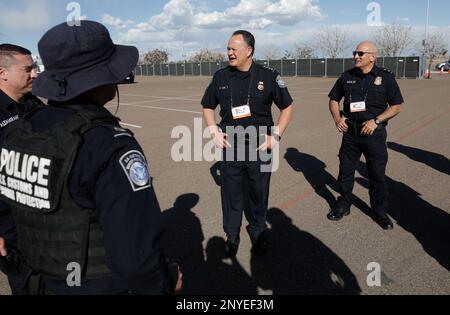 U.S. Customs and Border Protection Executive Assistant Commissioner Office of Field Operations Pete Flores visits with CBP officers conducting Non-Intrusive Inspections on a secure lot in advance of Super Bowl LVII in Glendale, Ariz., Feb. 6, 2023. CBP Photo by Glenn Fawcett Stock Photo