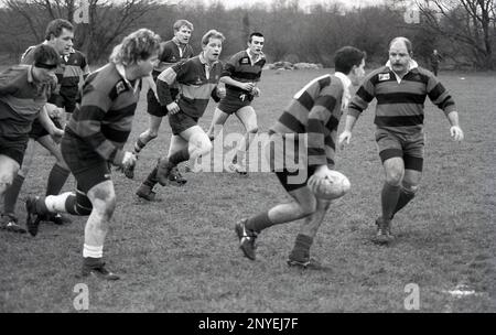 1980s, historical, amateur rugby union match, a player reaching for a ...