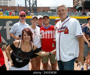 Former Atlanta Braves player Dale Murphy tips his hat to cheering fans  before a spring baseball exhibition game against the Miami Marlins, Friday,  March 15, 2019, in Kissimmee, Fla. (AP Photo/John Raoux