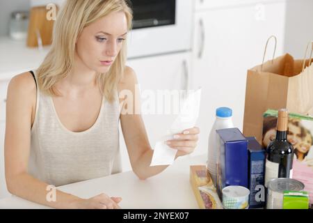 a woman calculates the expense Stock Photo