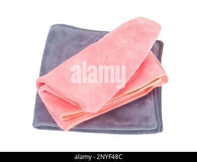 Folded pink and grey colour microfiber cleaning cloth on a white background. Stock Photo