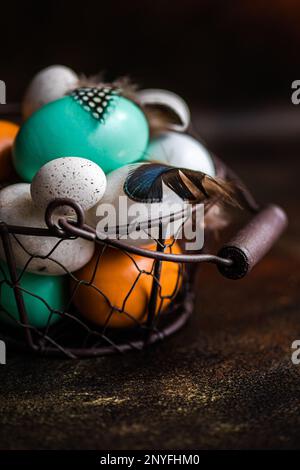 Basket with easter card concept with eggs on rustic brown background Stock Photo