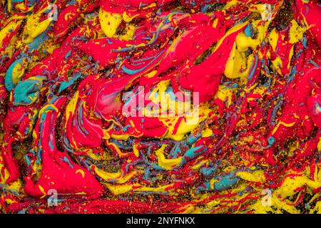 Abstract background of multiple bright yellow and red bubbles of oil in liquid Stock Photo