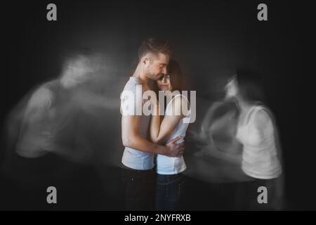 Couple embracing posing in studio Stock Photo