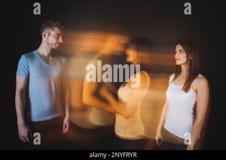 Couple embracing posing in studio Stock Photo