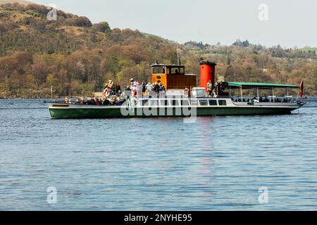 Tourists on board Ullstwater Steamers Motor Yacht The Lady of The Lake steamer approaching Howtown pier on Ullswater the Lake District,Cumbria Stock Photo