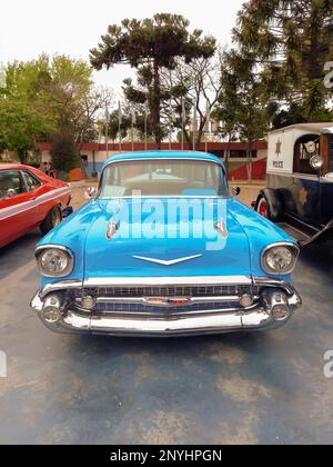 Lanus, Argentina - Sept 25, 2022: Old sky blue 1957 Chevrolet Chevy Bel Air sport sedan two door in the a park. Iconic classic car. Stock Photo