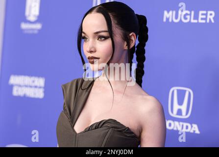 INGLEWOOD, LOS ANGELES, CALIFORNIA, USA - MARCH 01: Dove Cameron wearing a Jacquemus dress, Giuseppe Zanotti shoes, and Tyler Ellis clutch arrives at the 2023 Billboard Women In Music held at the YouTube Theater on March 1, 2023 in Inglewood, Los Angeles, California, United States. (Photo by Xavier Collin/Image Press Agency) Stock Photo