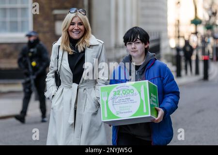 Downing Street, London, UK. 2nd March 2023. Barnardo's children's charity ambassador and former EastEnders actress Michelle Collins along with Darya, 17, from Bristol who relied on free school meals, hand in a petition of 32,000 signatures to Downing Street which calls on the government to introduce free school meals for all primary school pupils in England. Photo by Amanda Rose/Alamy Live News Stock Photo