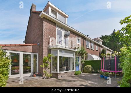 Amsterdam, Netherlands - 10 April, 2021: the outside of a house that looks like it's been taken out in the sun, and is very nice Stock Photo