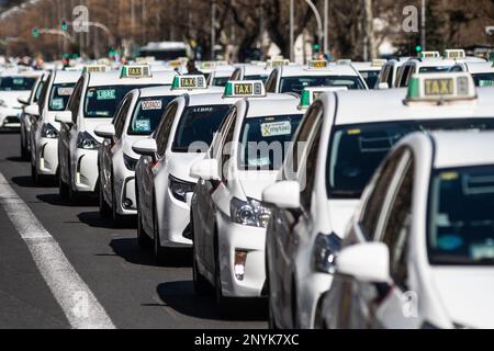 Madrid, Spain. 02nd Mar, 2023. Taxi drivers demonstrate with their vehicles driving through downtown Madrid blocking traffic, demanding regulations in their sector. Credit: Marcos del Mazo/Alamy Live News Stock Photo
