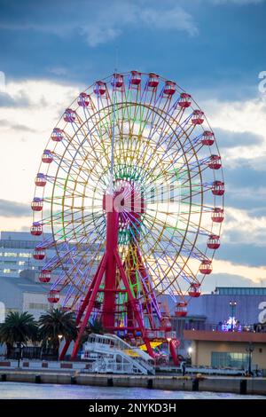 Kobe Japan Dec 6th 2022: the closeup image of Mosaic Big Ferris Wheel in the evening.  With its radially changing neon lights, is a wonderful sight Stock Photo