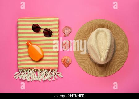 Flat lay composition with different beach objects on pink background Stock Photo