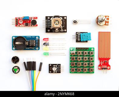 Electrical components kit for building digital devices isolated on white. Robotics parts and elements. Electronics module set Stock Photo