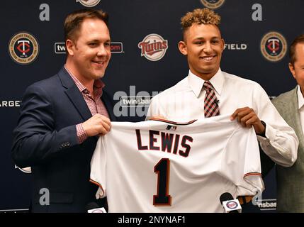 Minnesota Twins chief baseball officer Derek Falvey, left, and first  overall MLB draft pick Royce Lewis, hold up his new jersey as he was  introduced to the media between a double-header with