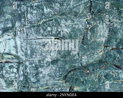 Background image of light blue cracked stone surface. Abstract nature theme and textures Stock Photo