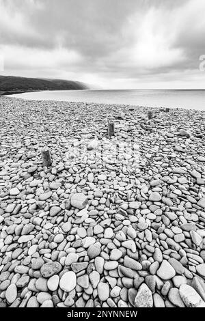 The stony beach at Bossington (looking towards Porlock Weir) on the north coast of Exmoor National Park, Somerset, England UK Stock Photo