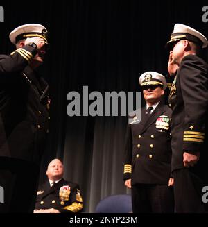 230106-N-CE703-0112 KEYPORT, Wash. (Jan. 6, 2023) Cmdr. John Thorpe(right)  and his replacement,