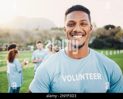 Man in portrait, volunteer and smile with eco friendly help, environment and sustainability, green and waste management. Cleaning, charity and team Stock Photo