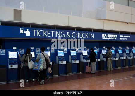 March 2, 2023, Tokyo, Japan: A family of passengers use the automated Ticketing and Check In kiosks for ANA at Terminal 2 of Tokyo Haneda International Airport. (HND) The airline industry faces a severe staffing and pilot shortage as international travel rebounds after the COVID-19 pandemic.ANA (All Nippon Airways å…¨æ-¥æœ¬ç © ºè¼¸æ ªå¼ä¼šç¤¾) is one of the leading airlines in the Asia-Pacific region. Founded in 1952, it has grown to become the largest airline in Japan, operating both domestic and international flights. ANA has a fleet of over 250 aircraft, including Boeing 787 Dreamliners an Stock Photo