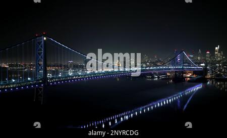 Benjamin Franklin Bridge and Skyline of Philadelphia at night - aerial view Stock Photo