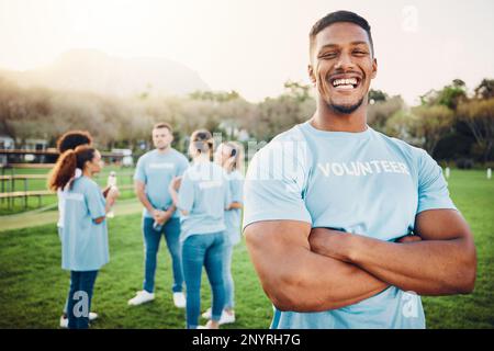 Man in portrait, volunteer and happy with eco friendly help, environment and sustainability, green and waste management. Cleaning, charity and team Stock Photo