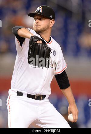 The University of Miami's Alex Fernandez, son of the former Florida Marlins  pitcher of the same name, throws a pitch in the fourth inning against the  Marlins in exhibition play at Marlins