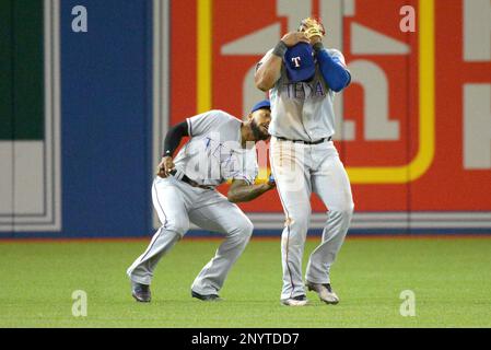 Texas Rangers' Delino DeShields (left), Texas Rangers' Joey Gallo (center)  and Washington Nationals' Bryce Harper (right) socialize prior to a  baseball game against the Texas Rangers, Sunday, June 11, 2017, in  Washington. (