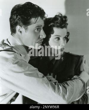 American actor Don Ameche and actress Joan Bennet in the movie Confirm or Deny, USA 1941 Stock Photo