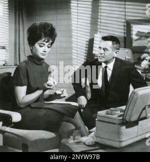 American actor Glenn Ford and actress Suzanne Pleshette in the movie Fate is the Hunter, USA 1964 Stock Photo