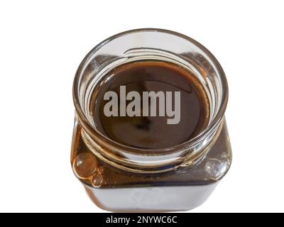Chestnut honey in a jar isolated on white background Stock Photo
