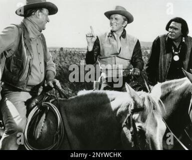 American actors John Wayne and Kirk Douglas in the movie The War Wagon, USA 1967 Stock Photo