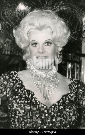 Irish singer, actor and entertainer Danny La Rue dressed as Dolly Levi, UK 1983 Stock Photo