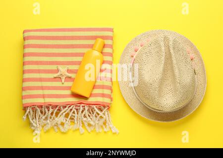Flat lay composition with different beach objects on yellow background Stock Photo