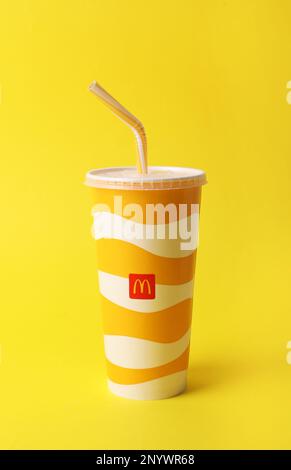 MYKOLAIV, UKRAINE - AUGUST 12, 2021: Cold McDonald's drink on yellow background Stock Photo