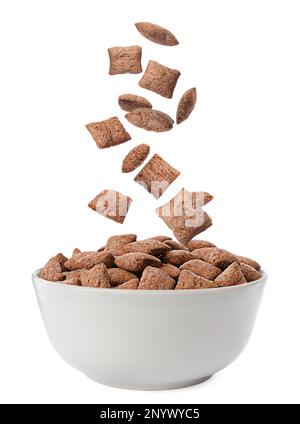 Sweet crispy corn pads falling into bowl on white background Stock Photo