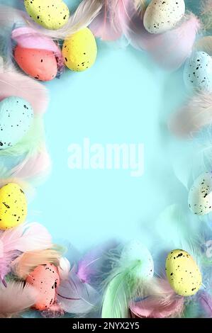 Easter background with feathers and eggs on blue background. Flat lay. Happy easter day card. Stock Photo