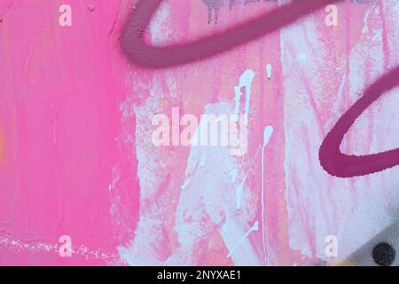 Messy paint strokes and smudges on an old painted wall. Colorful drips, flows, streaks of paint and paint sprays Stock Photo