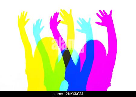 CMYK, cyan magenta yellow light colors mixed together, multi colored child silhouettes cut out abstract color mixing idea. Photography and print abstr Stock Photo