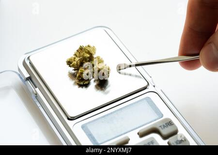 https://l450v.alamy.com/450v/2nyxmj7/cannabis-marijuana-on-an-electric-scale-preparing-buds-of-medical-marijuana-thc-cbd-soft-drugs-concept-nobody-object-macro-extreme-closeup-det-2nyxmj7.jpg