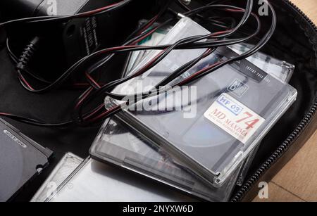 A bag full of Sony Mini Discs for an old retro voice recorder, MD, retro voice recording equipment, 90s audio rec technology abstract concept, group o Stock Photo