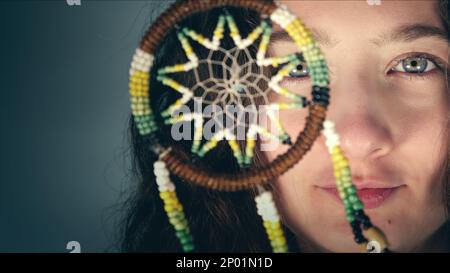 Young Girl is Holding a Mystic Dreamcatcher Photo Stock Photo